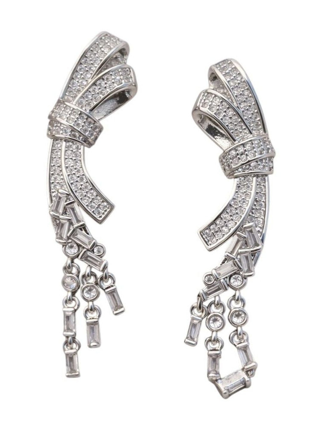 Duplicate of image five — same on-ear shot of the silver CZ bow drop earring