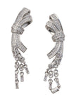 Duplicate of image five — same on-ear shot of the silver CZ bow drop earring