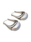 Silver pearl dome hoop earrings photographed against a clean white background showing full silhouette and finish