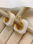 Close-up side view of pearl resin hoops showing gold inner hoop and rubber push-back stoppers
