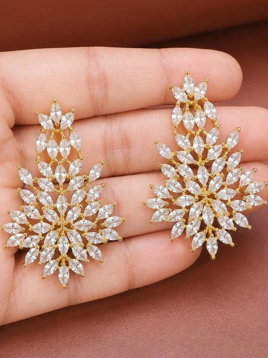 Pair of marquise CZ floral drop earrings resting on an open palm showing full size and detail
