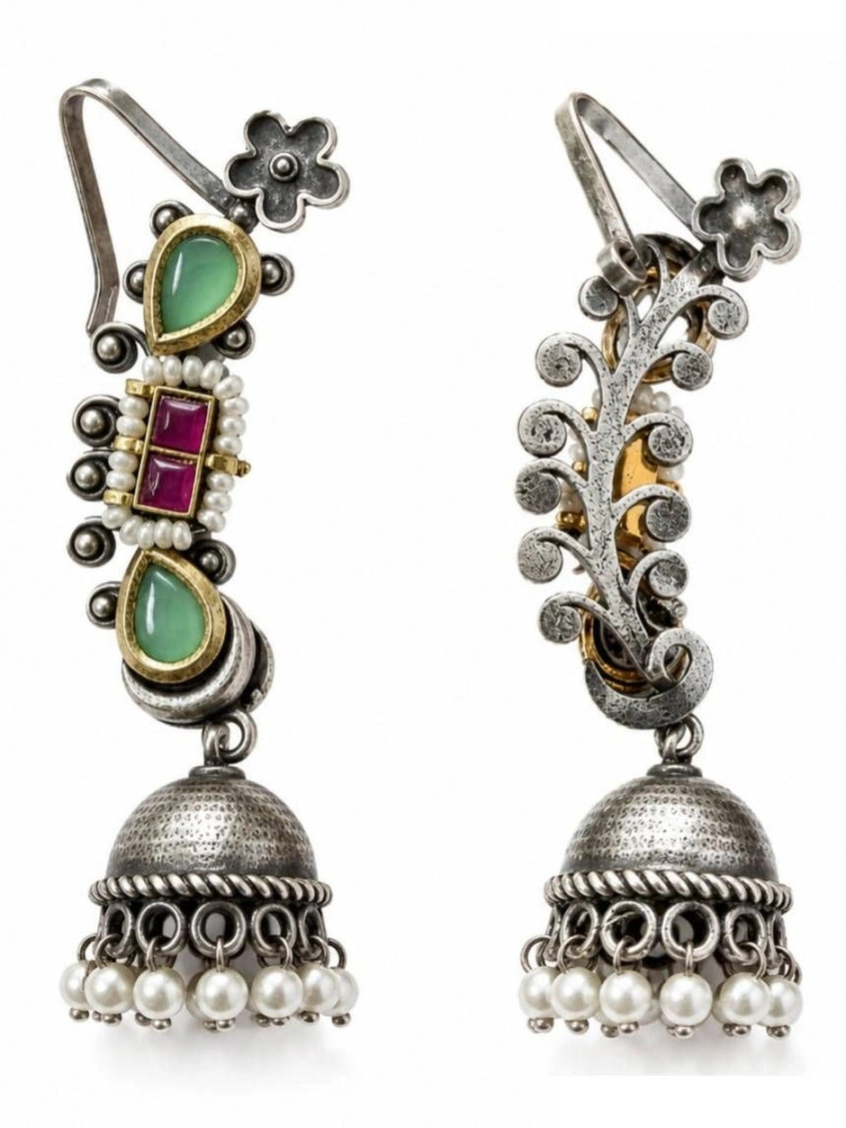 Front and back views of oxidised ear cuff jhumka showing green stones on front and ornate scroll-work detailing on reverse