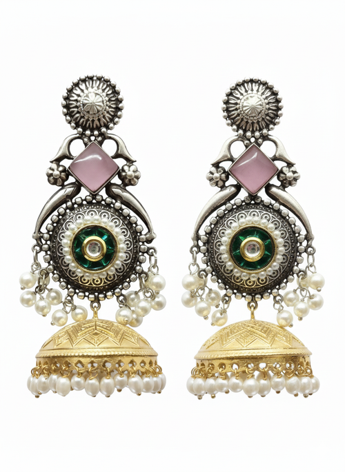 Ornate earrings with gold and silver details on a white background
