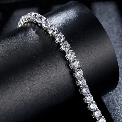 Diamond tennis bracelet on a dark surface