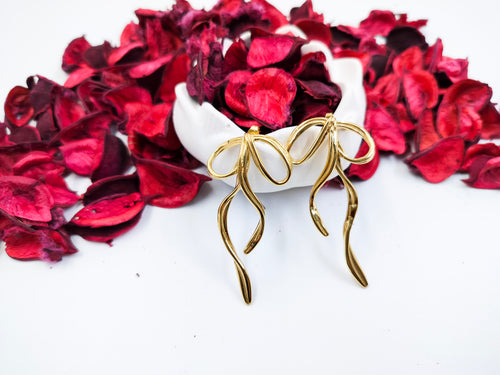 Trendy gold bow drop earrings for women, lightweight anti-tarnish jewelry design perfect for parties, weddings and gifting.