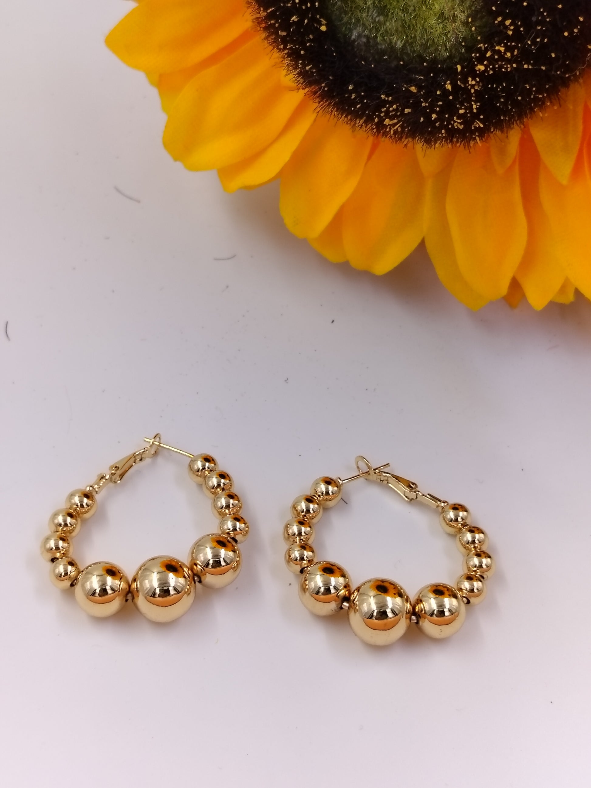Trendy gold beaded hoop earrings for women, lightweight anti-tarnish jewelry perfect for casual outings, parties and gifting.