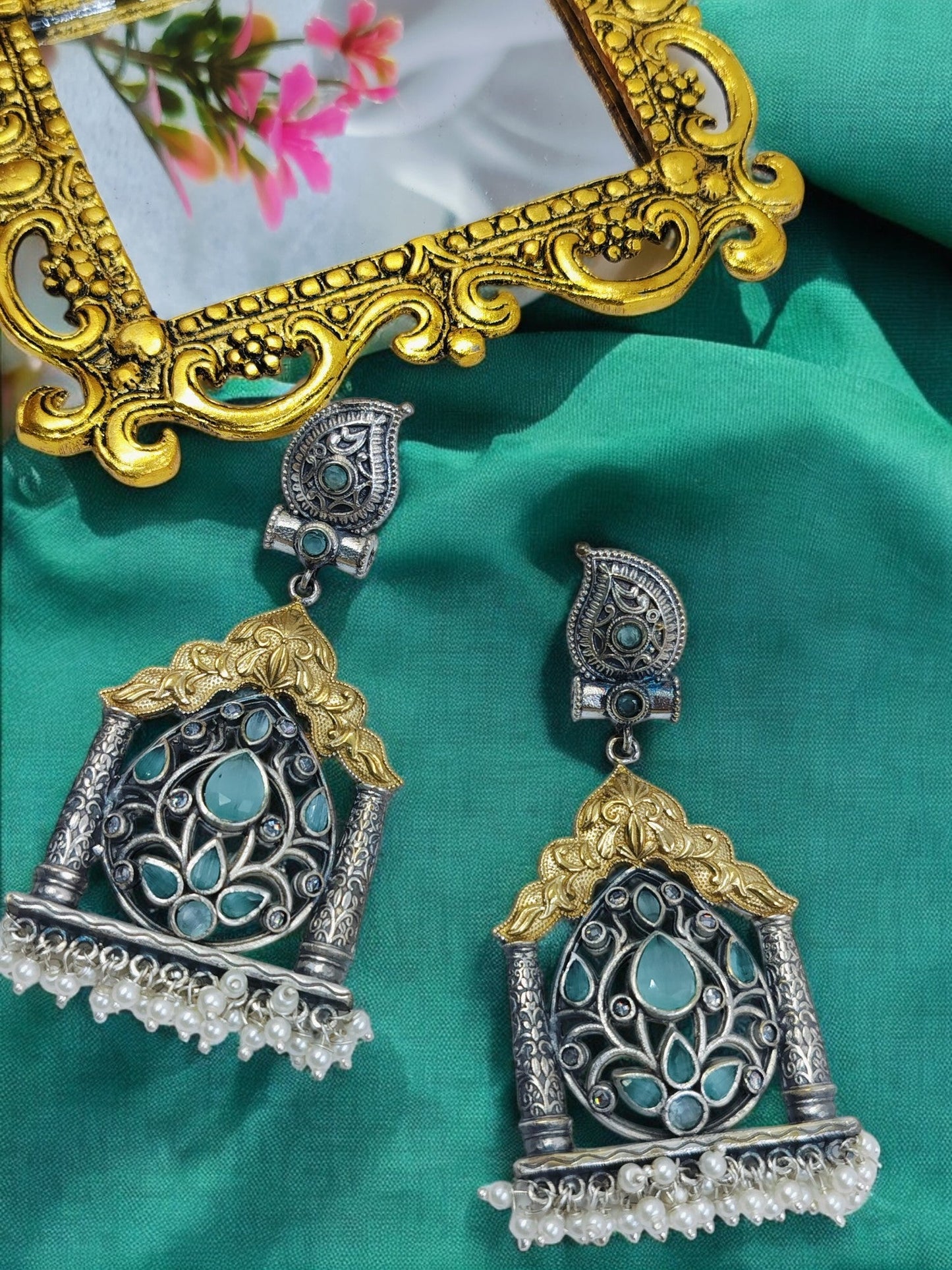 Oxidised silver earrings with golden temple arch, turquoise floral stone pattern and pearl bead drops.
