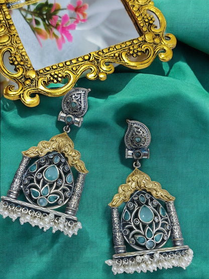 Oxidised silver earrings with golden temple arch, turquoise floral stone pattern and pearl bead drops.