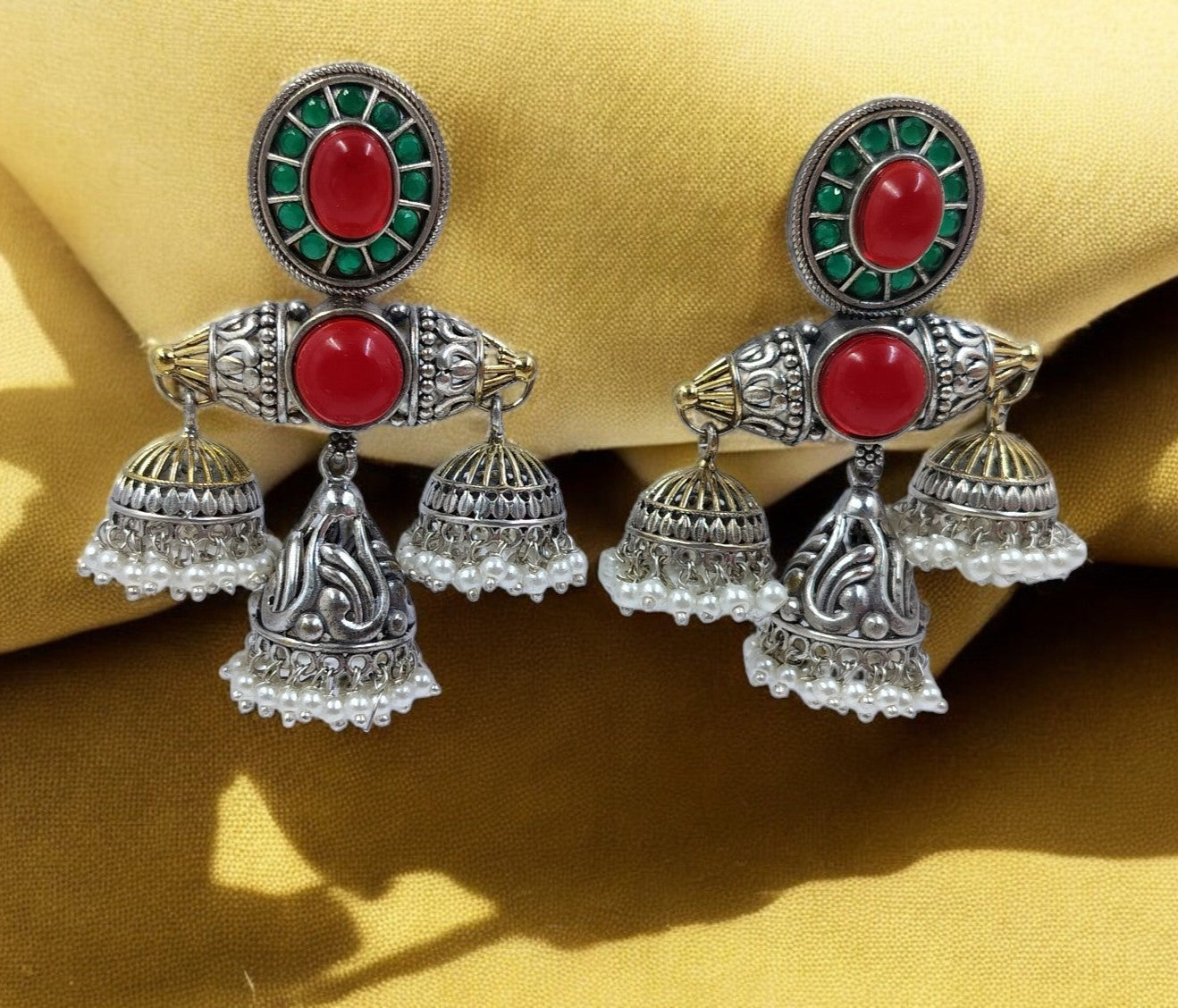 Regal red & emerald green stones with triple jhumka drops – royal elegance redefined.