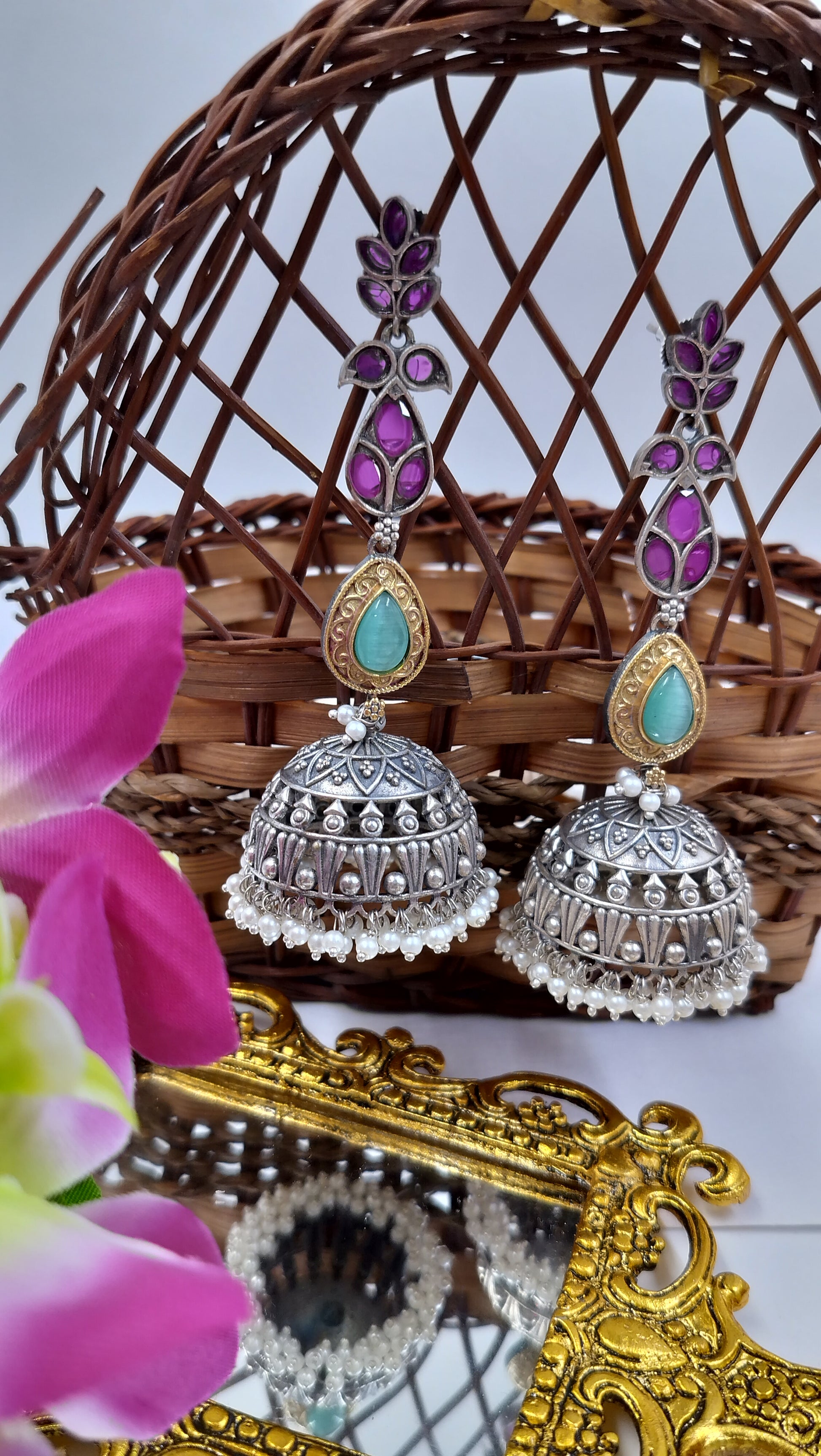 Statement silver dome jhumkas with purple floral tops & turquoise accents – perfect for festive glam.