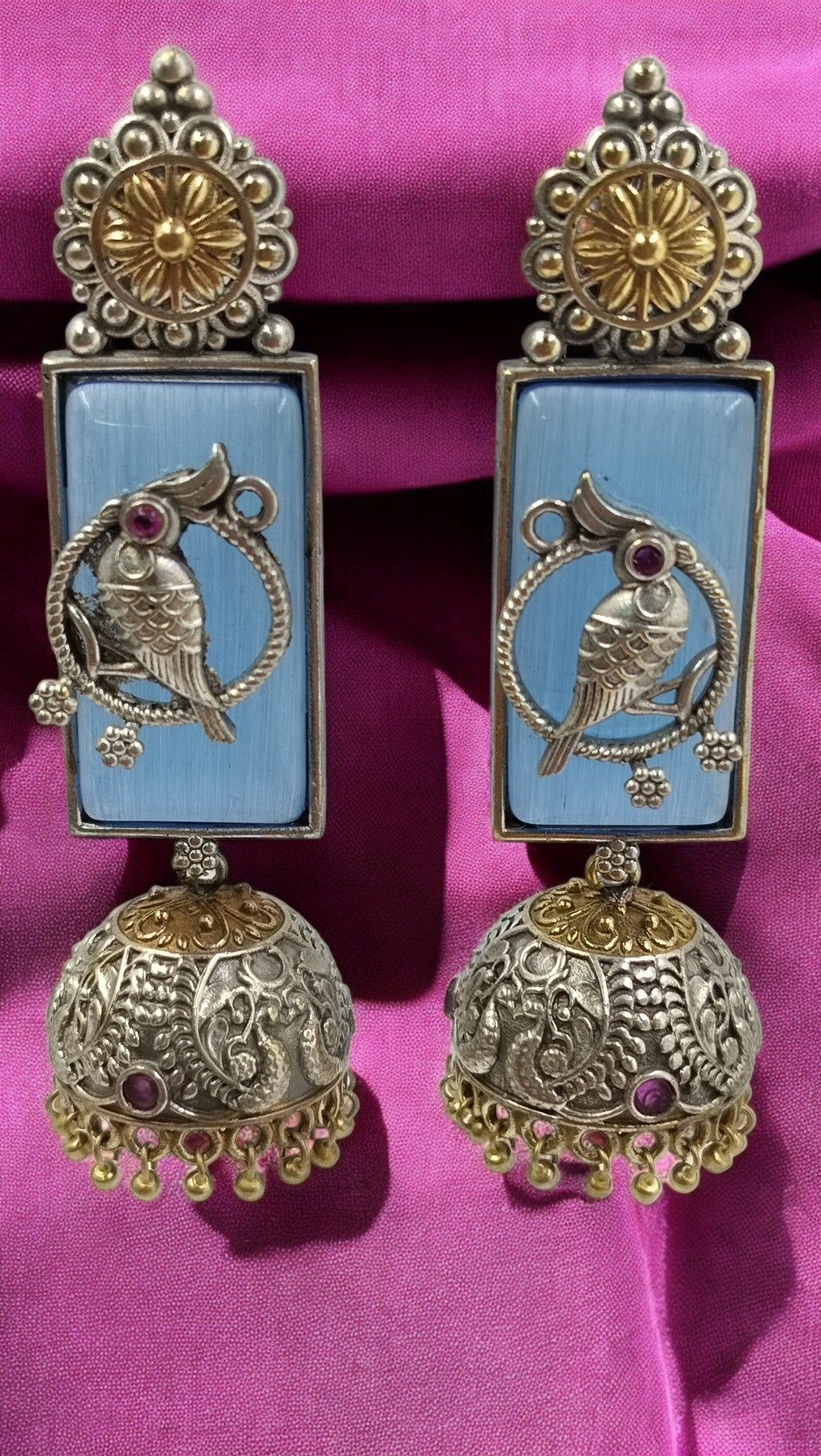 Sky blue elegance with intricate parrot artistry – a timeless blend of tradition & grace.