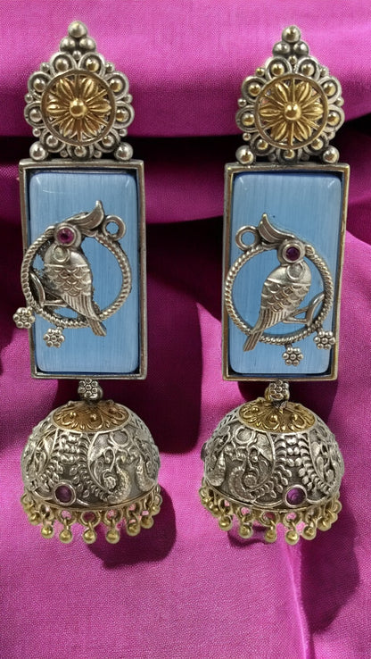 Sky blue elegance with intricate parrot artistry – a timeless blend of tradition & grace.