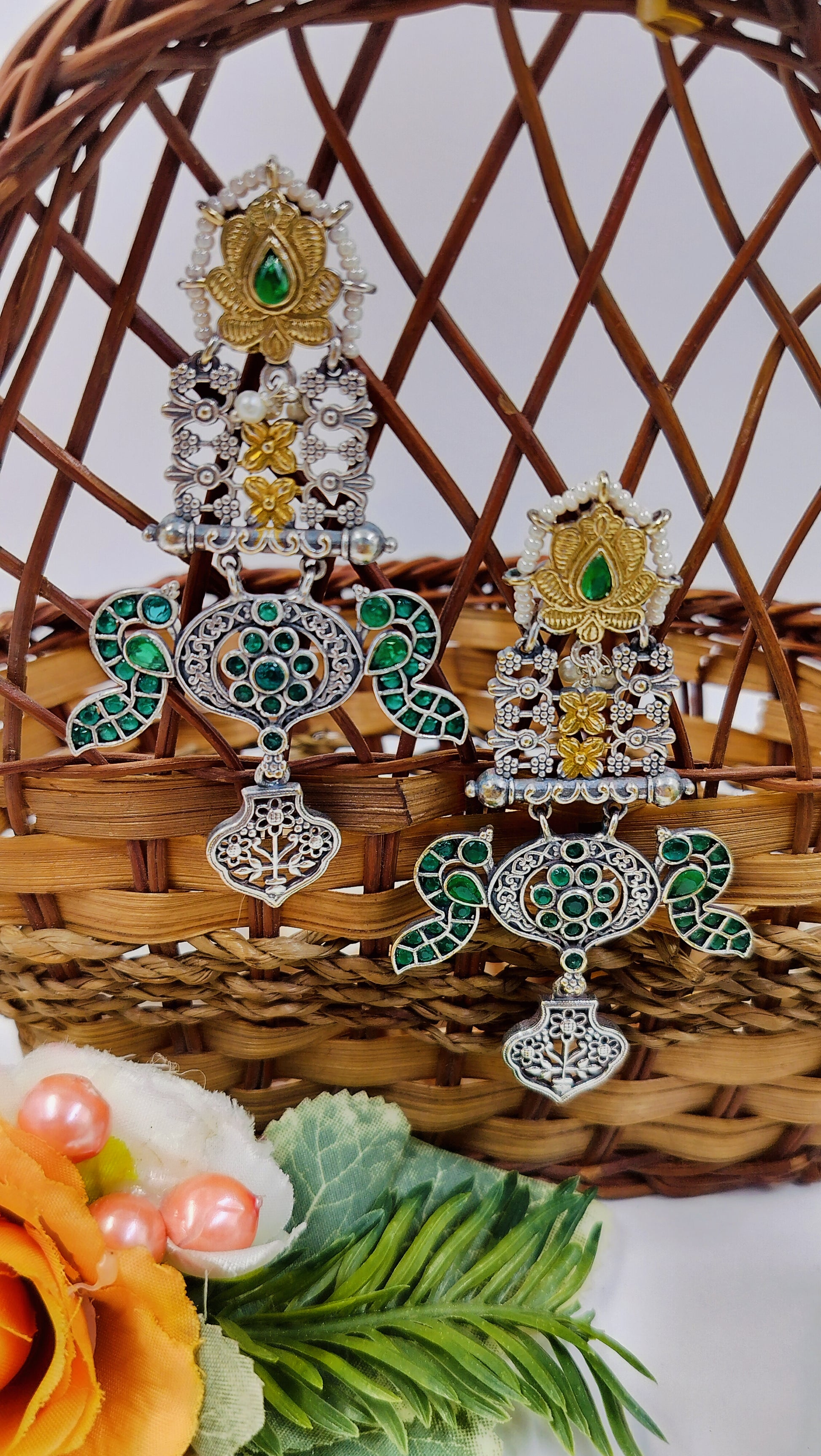 Antique long statement earrings with green stones, golden accents, and intricate carvings for festive elegance