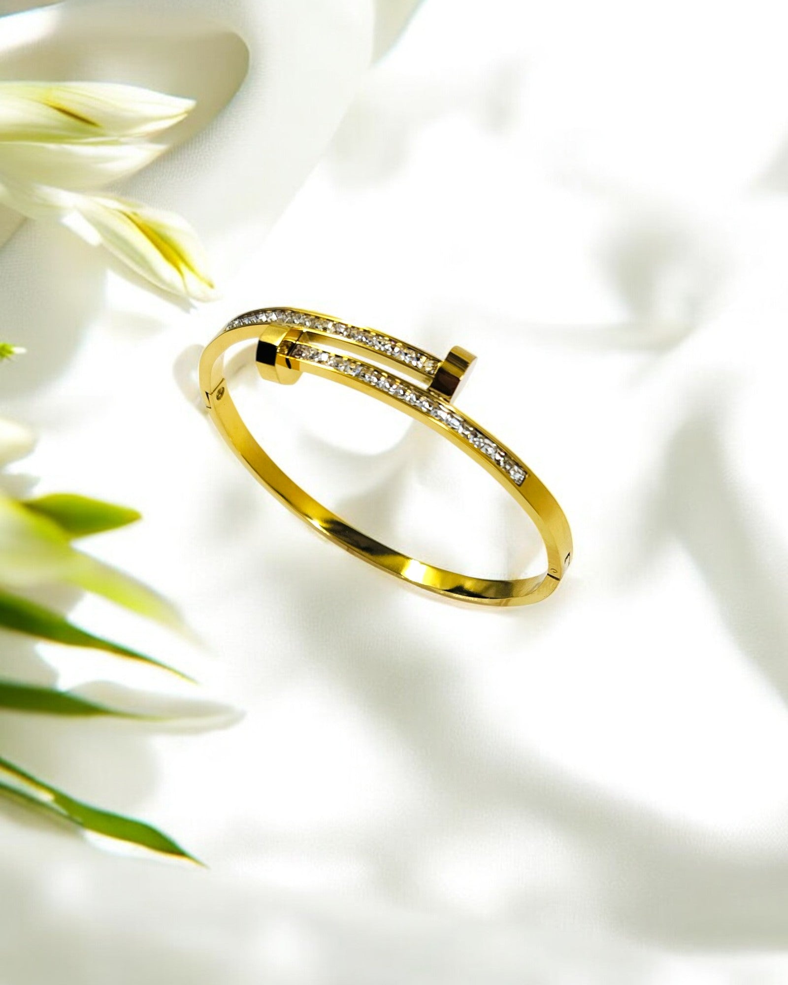 Elegant gold plated bangle with sparkling stone detailing – a perfect blend of sophistication and style for parties, weddings, and daily wear.