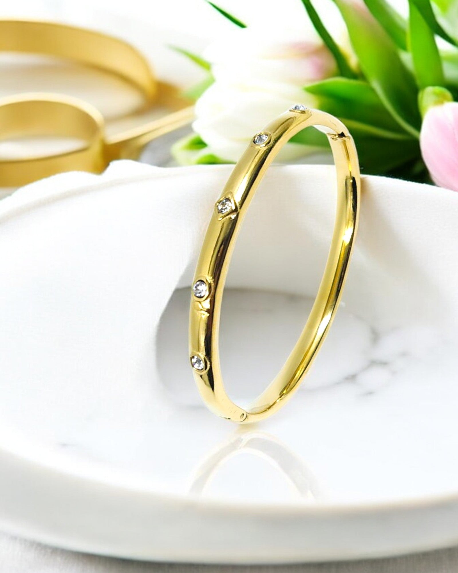 Minimalist gold plated bracelet with delicate sparkling CZ stones, a timeless piece perfect for daily wear and special occasions.