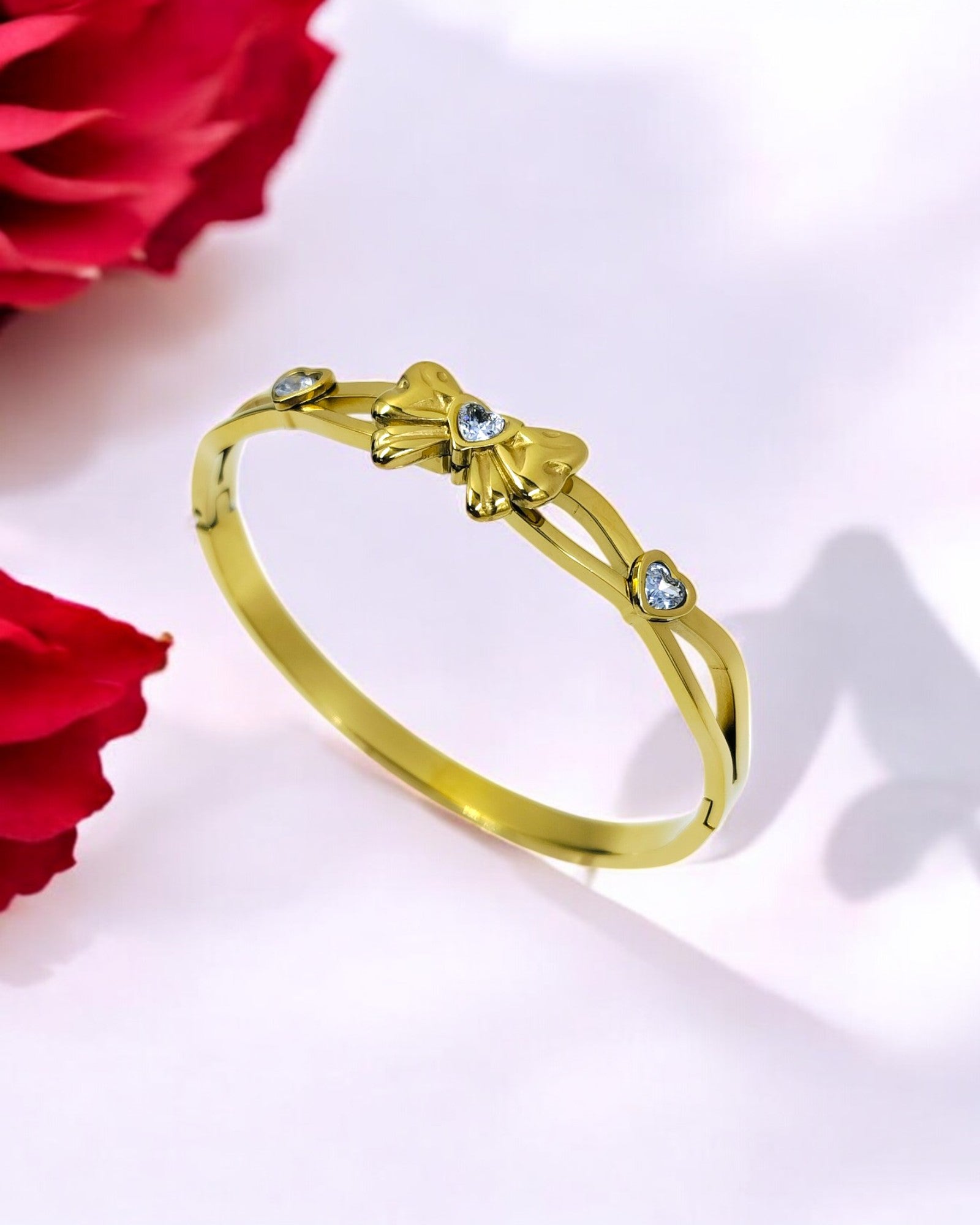 Gold plated bracelet with elegant bow design and sparkling stones, stylish women’s jewelry perfect for parties and gifting.