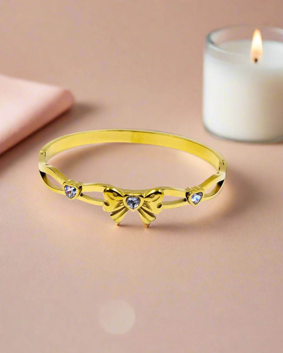 Elegant gold plated bangle bracelet with colorful clover motifs, trendy statement jewelry perfect for women’s festive style.