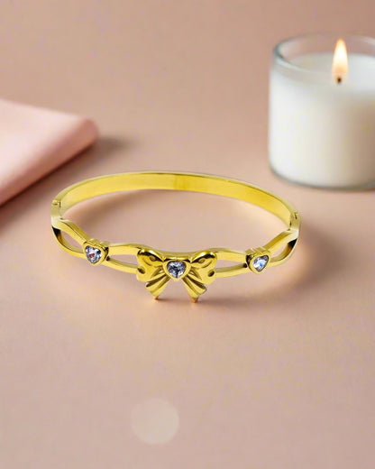 Elegant gold plated bangle bracelet with colorful clover motifs, trendy statement jewelry perfect for women’s festive style.