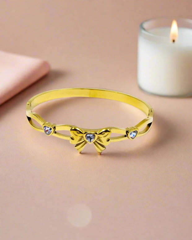 Elegant gold plated bangle bracelet with colorful clover motifs, trendy statement jewelry perfect for women’s festive style.