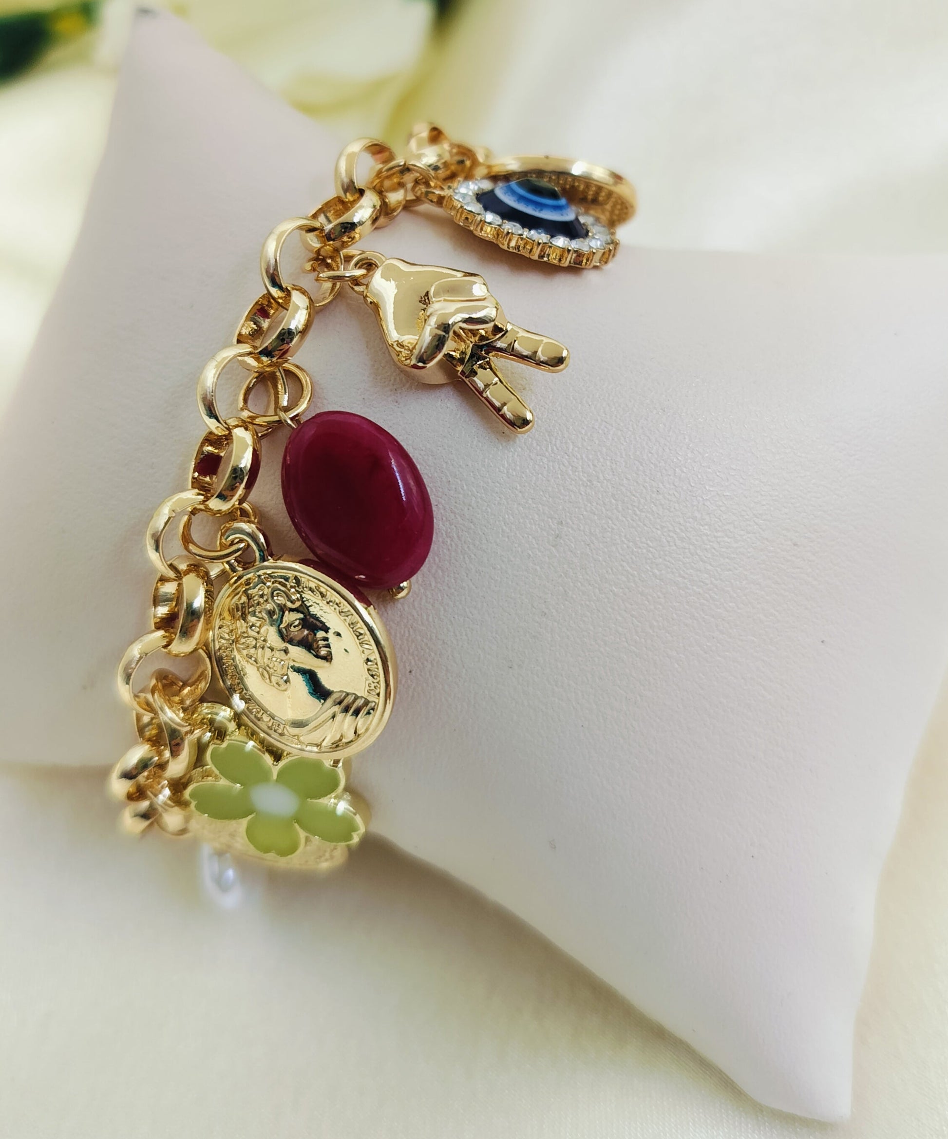 Golden charm bracelet for women with dragonfly, pearl, leaf and donut charms – trendy jewelry for girls