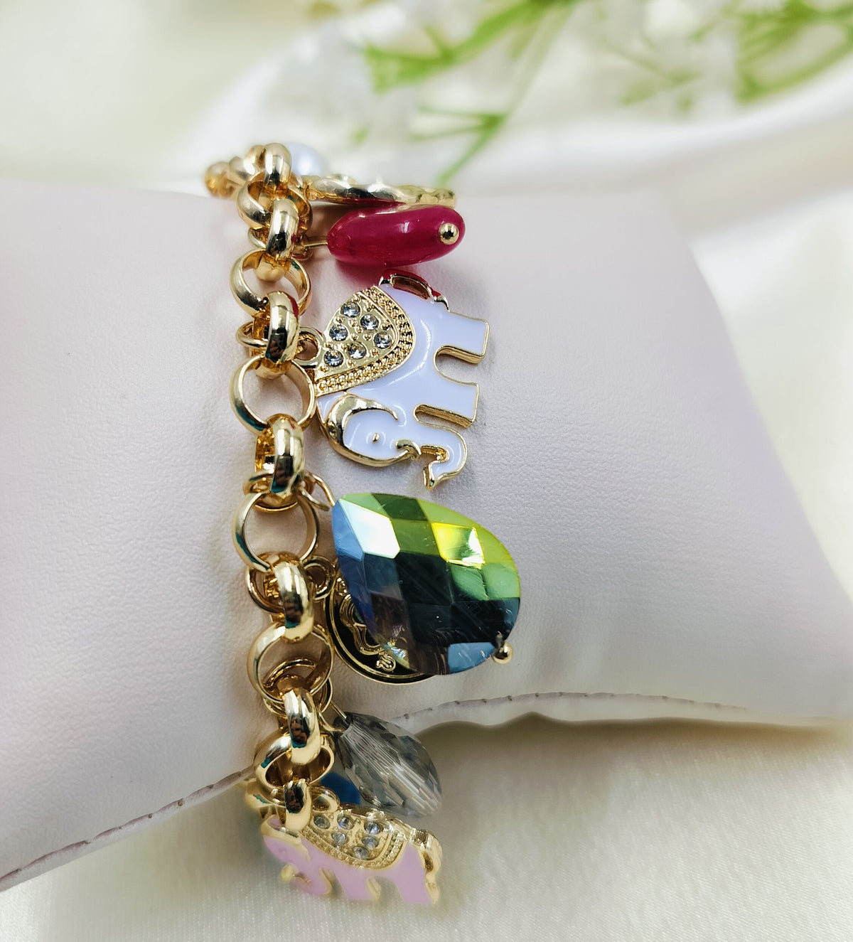 Gold charm bracelet with colorful gemstones and enamel elephant charms, stylish women's fashion jewelry