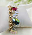 Gold charm bracelet with colorful gemstones and enamel elephant charms, stylish women's fashion jewelry