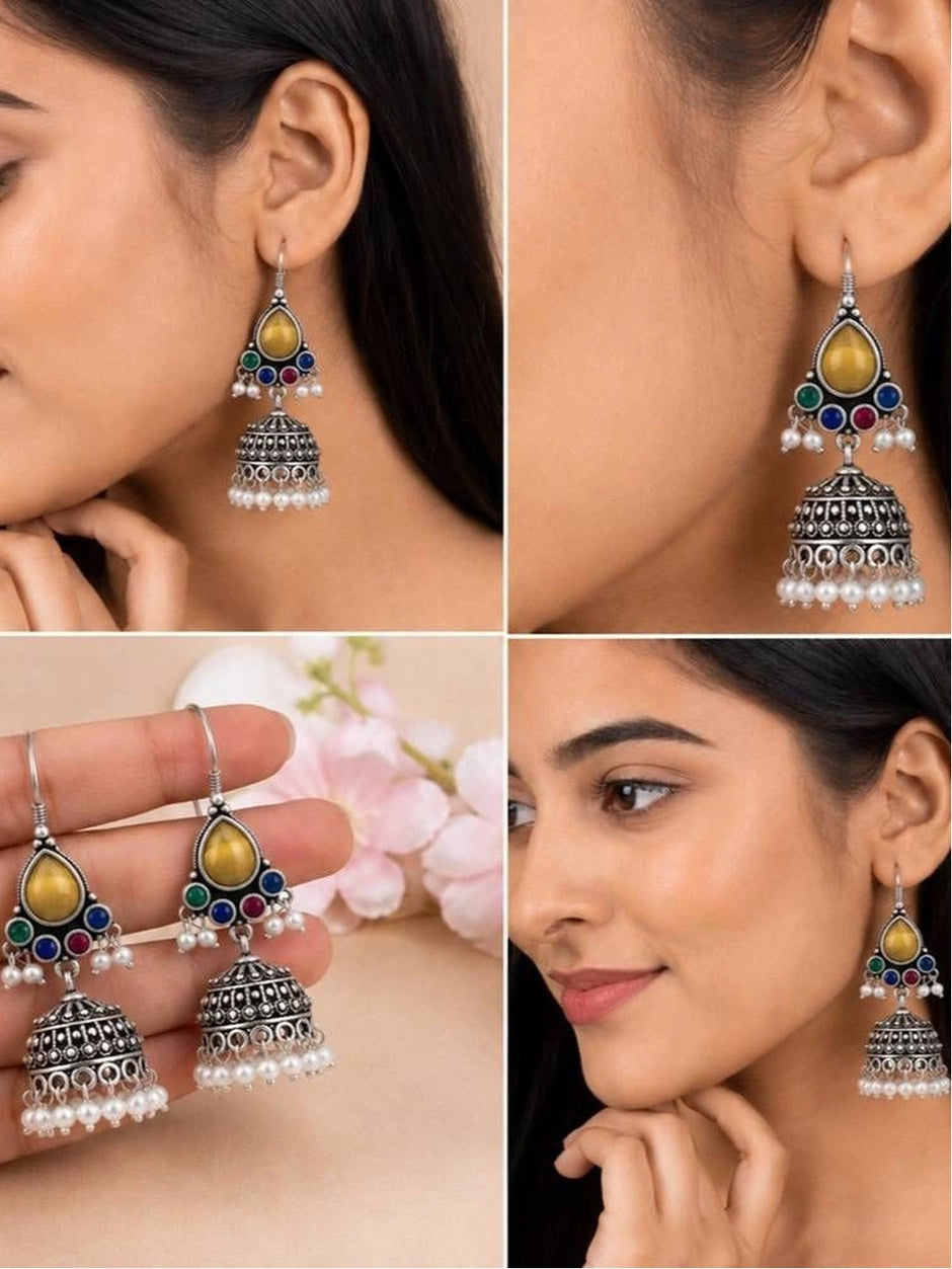 Four-panel collage showing oxidised silver jhumka earrings worn and held from multiple angles