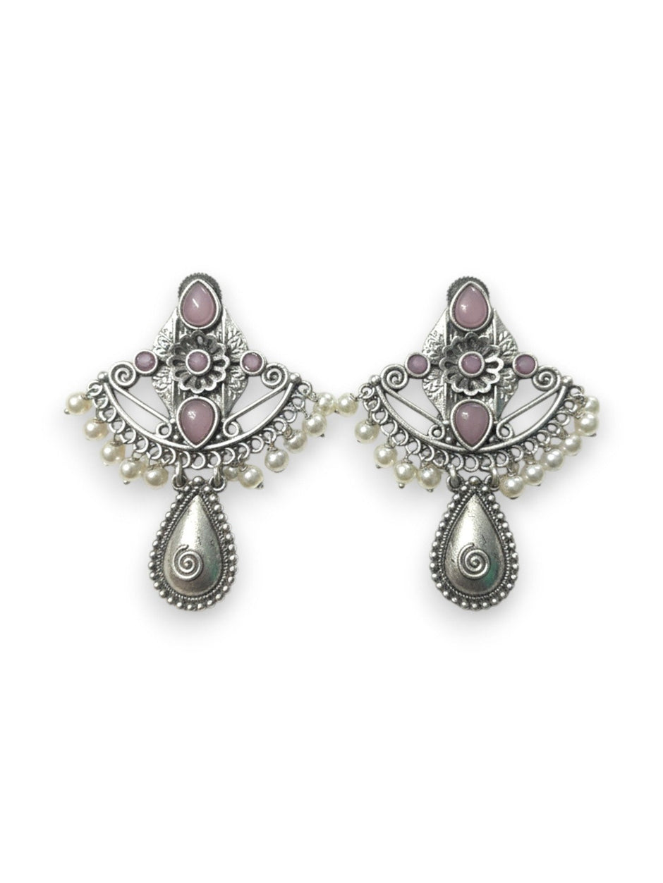 Front view of both oxidised silver chandbali earrings with blush-pink cabochons and teardrop pendant on white background