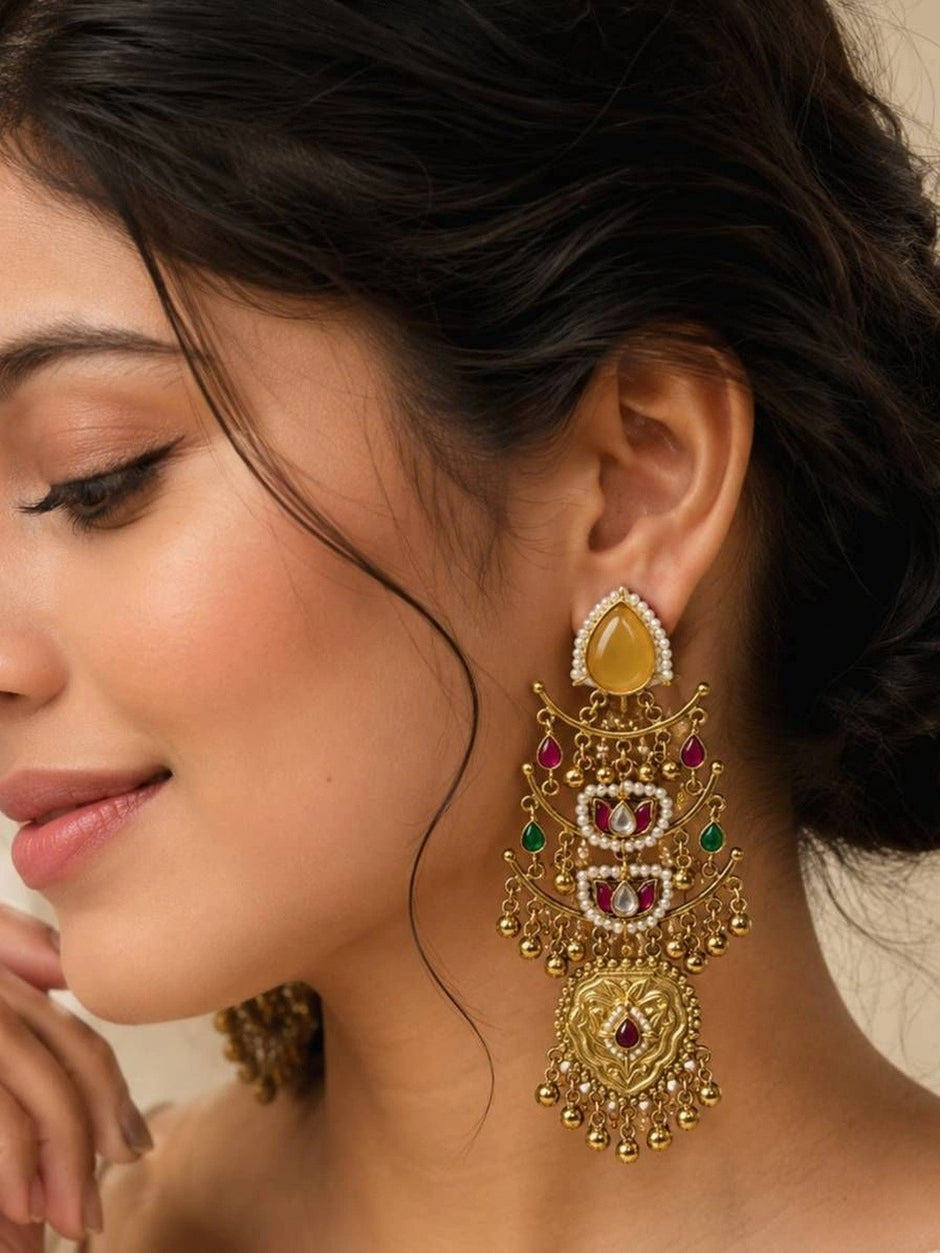 Gold-plated kundan chandbali earring worn on model showing full length drop against neck