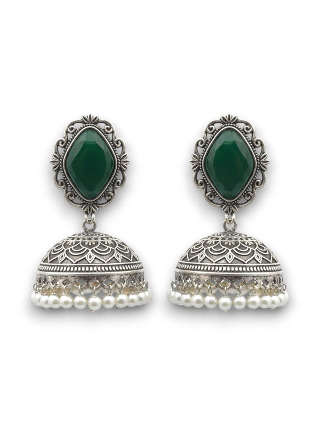 Pair of oxidised silver green stone jhumka earrings with engraved dome and pearl drops on a white background