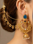 Gold-plated chandbali jhumka earring with hair chain worn on a woman with a low bun hairstyle, showing full drape and styling