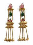 Pair of gold-plated meenakari tassel earrings laid flat on white background showing full design detail