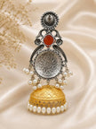 Single jhumka earring standing upright showing oxidised silver medallion back and gold dome bell with pearl border