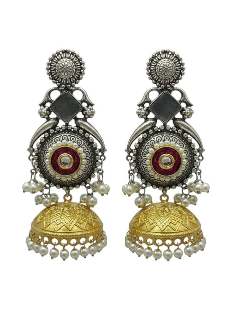 Front view of dual-tone kundan jhumka earrings showing engraved gold dome bell and faux pearl fringe on white background