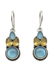 Front view of oxidised silver drop earrings with blue cabochon base and yellow faceted teardrop accent stones on white background