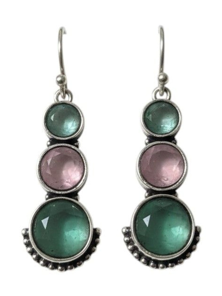 Front-facing pair of oxidised silver earrings with graduated teal and pink cabochon stones on white background