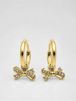 Two gold-plated bow charm hoop earrings displayed on white surface showing front and back angle