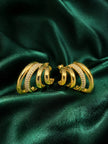 Pair of gold-plated triple-band hoop earrings with crystal pave on green satin fabric