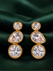 Pair of gold-plated bezel drop earrings with round pear and round crystal stones on green satin