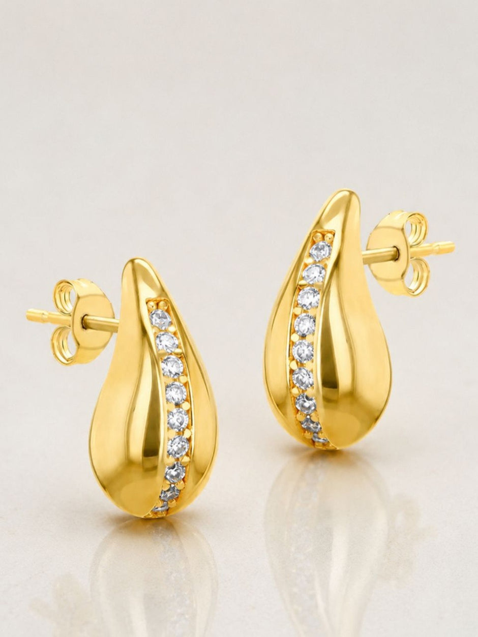 Front view of gold-plated teardrop stud earrings with zirconia sweep and butterfly push-back on white background
