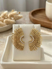 Pair of gold-toned sunburst fan stud earrings with zirconia stones displayed on a white jewellery card