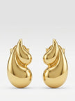 Front-facing product shot of gold-toned flame drop stud earrings on a clean white-grey background