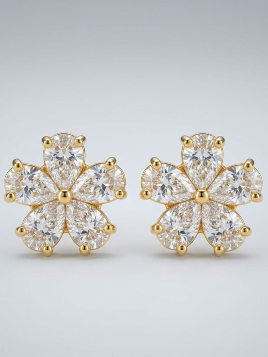Close-up render of gold-plated CZ flower stud earrings showing pear-cut stone detailing
