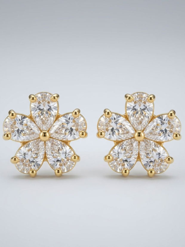 Close-up render of gold-plated CZ flower stud earrings showing pear-cut stone detailing