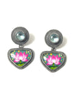 Pair of oxidised silver drop earrings with hand-painted teal and pink lotus enamel pendants on white background