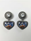 Flat lay of both meenakari drop stud earrings on white background showing blue, white, yellow and orange enamel floral design and rope-edge border