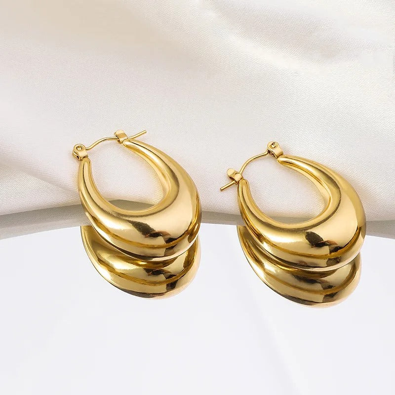 Classic gold oval hoop earrings for women, elegant fashion jewellery perfect.