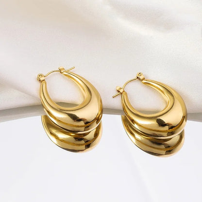 Classic gold oval hoop earrings for women, elegant fashion jewellery perfect.