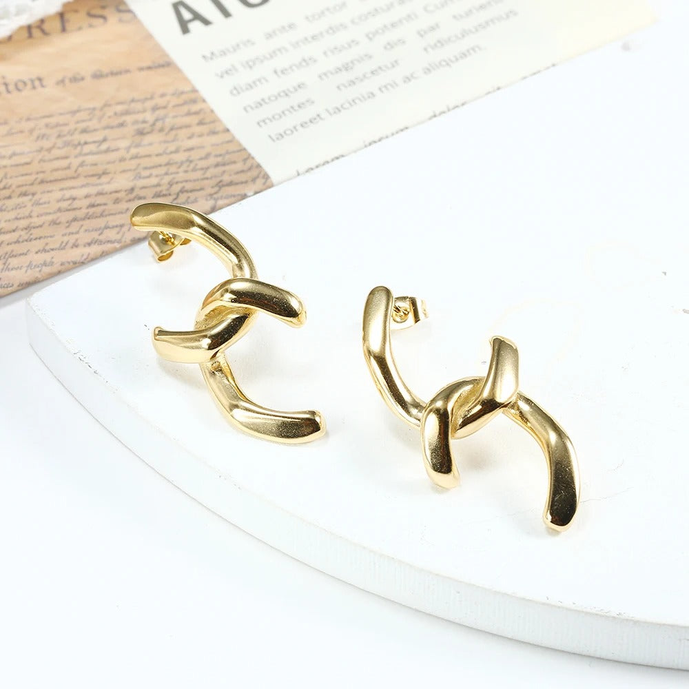 Modern gold plated twisted hoop earrings with bold chunky design, perfect for elevating everyday and party looks.