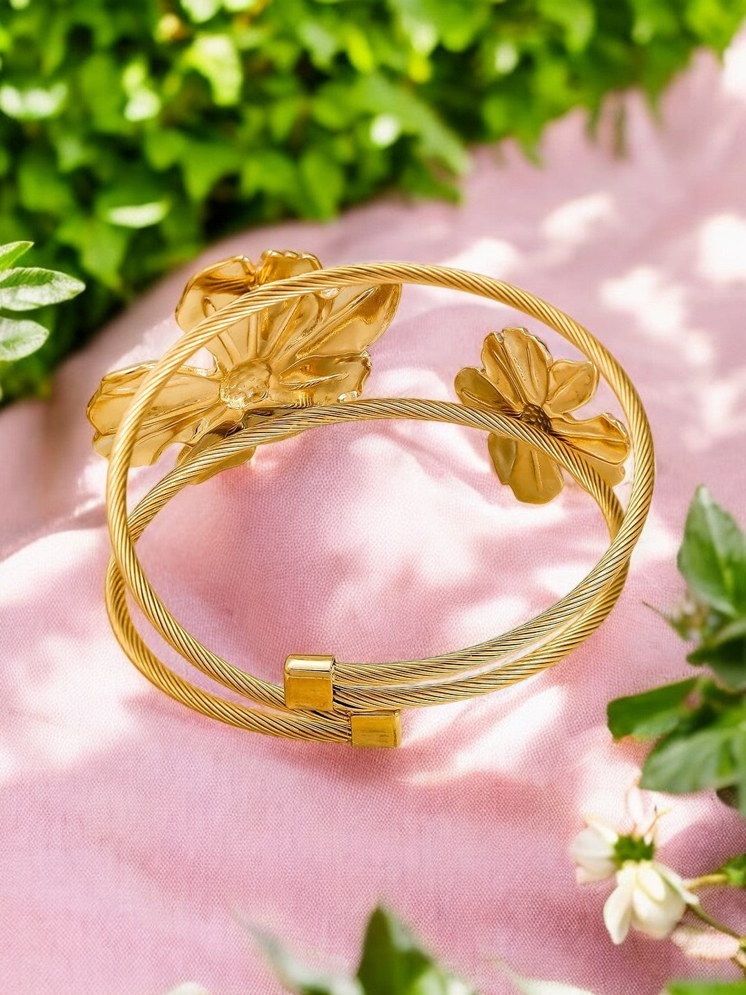 Chic gold plated floral cuff bracelet with dual flower motifs, a stylish and versatile accessory for parties, festive occasions, and everyday glam.